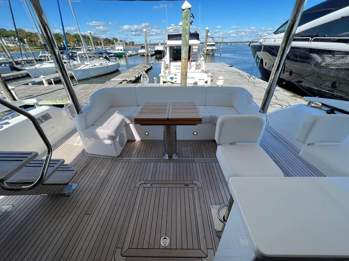 a deck with a deck and boats aboard 66 MANHATTAN Yacht for Sale