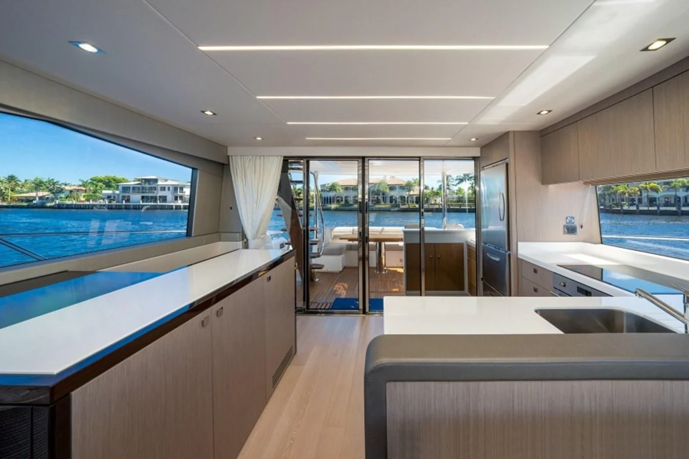 a room with a large window and a view of the water aboard 66 MANHATTAN Yacht for Sale