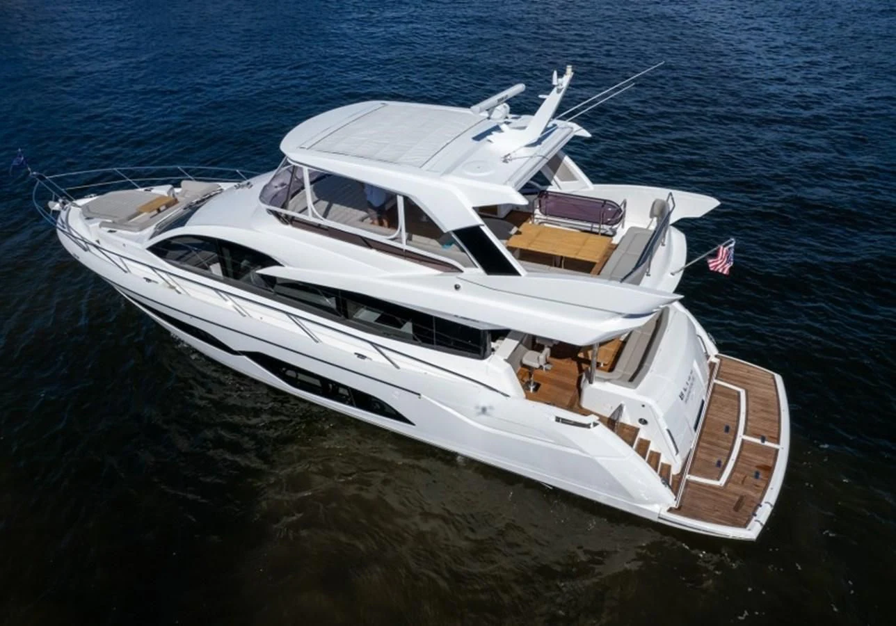 a white yacht on the water aboard 66 MANHATTAN Yacht for Sale