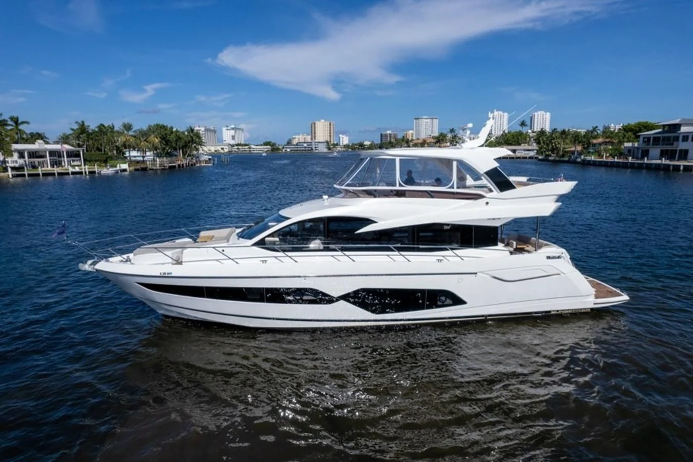 a white yacht on the water aboard 66 MANHATTAN Yacht for Sale