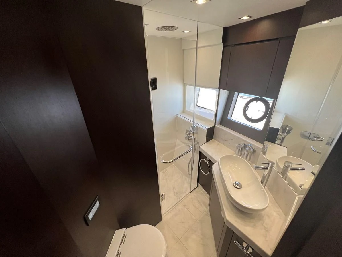 a bathroom with a large mirror aboard 66 MANHATTAN Yacht for Sale