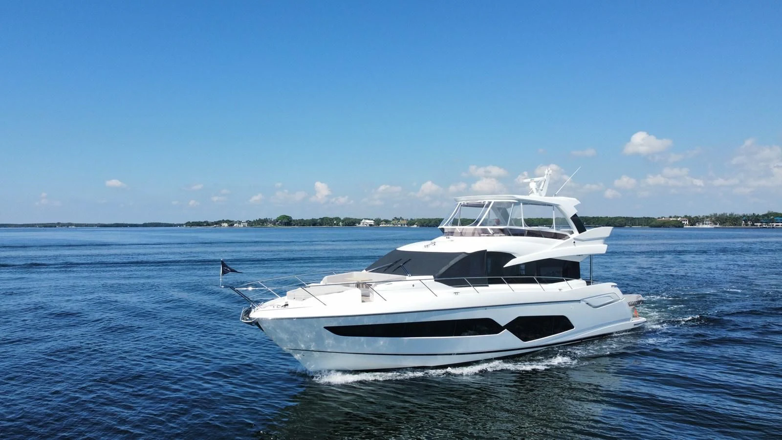 a white boat in the water aboard 66 MANHATTAN Yacht for Sale