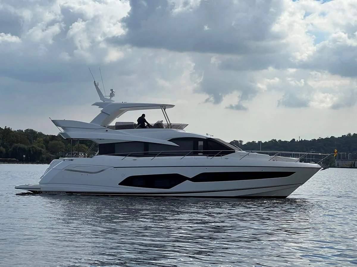 a white yacht on the water aboard 66 MANHATTAN Yacht for Sale