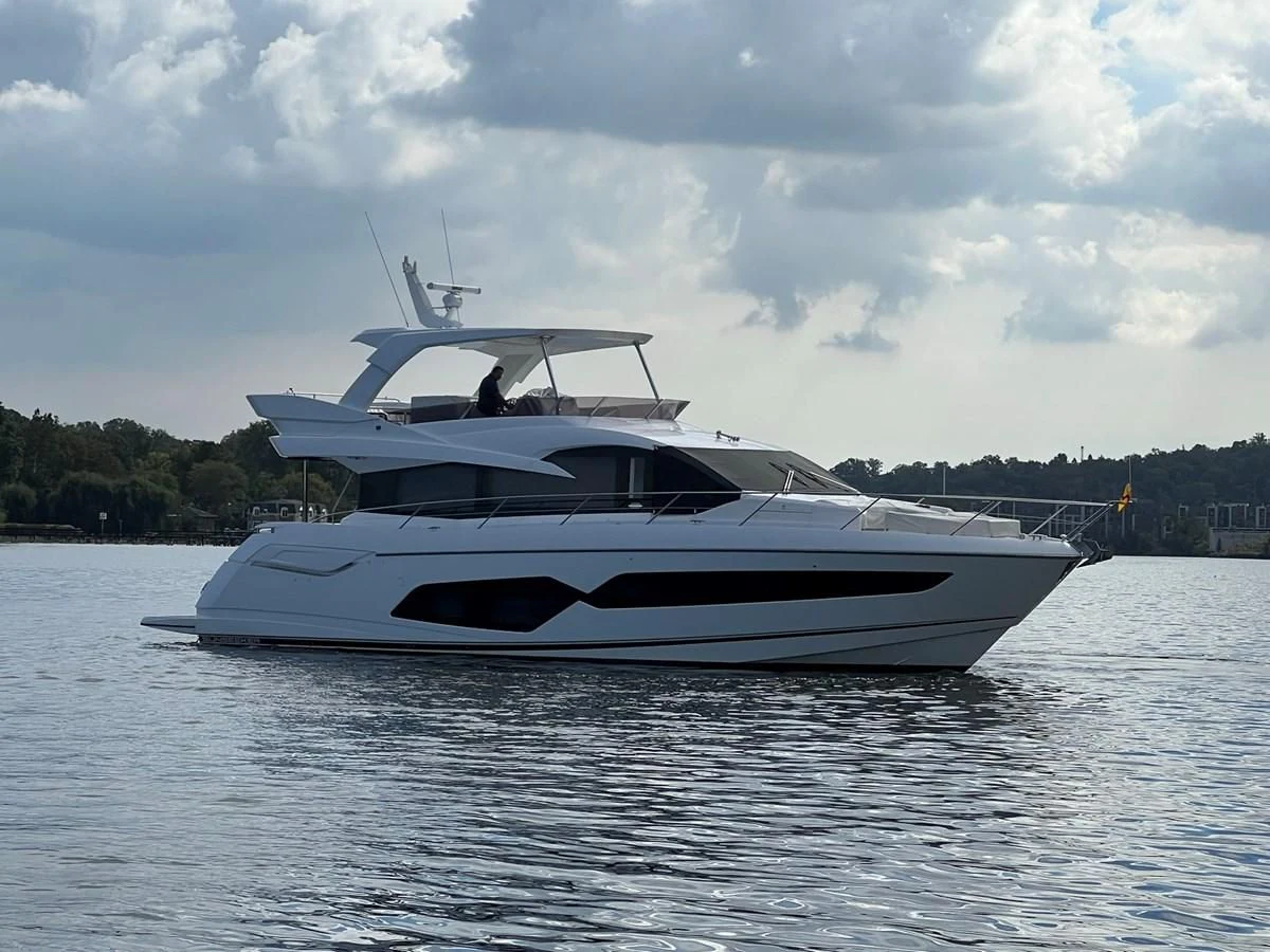 a white yacht on the water aboard 66 MANHATTAN Yacht for Sale