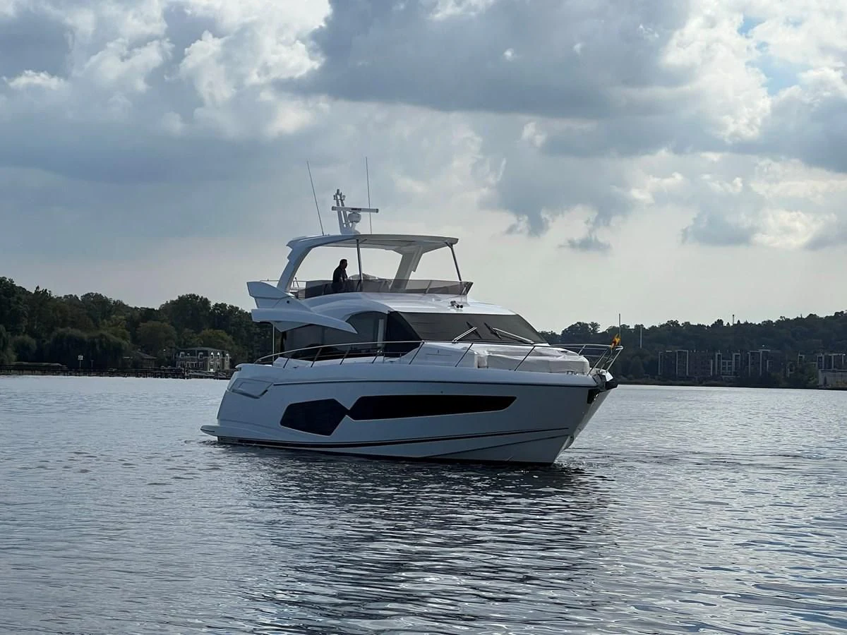 a white boat on the water aboard 66 MANHATTAN Yacht for Sale