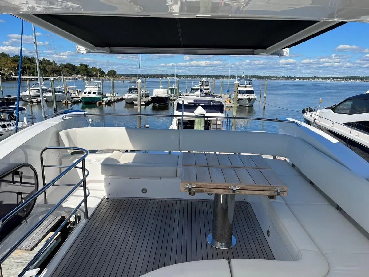 a dock with boats aboard 66 MANHATTAN Yacht for Sale