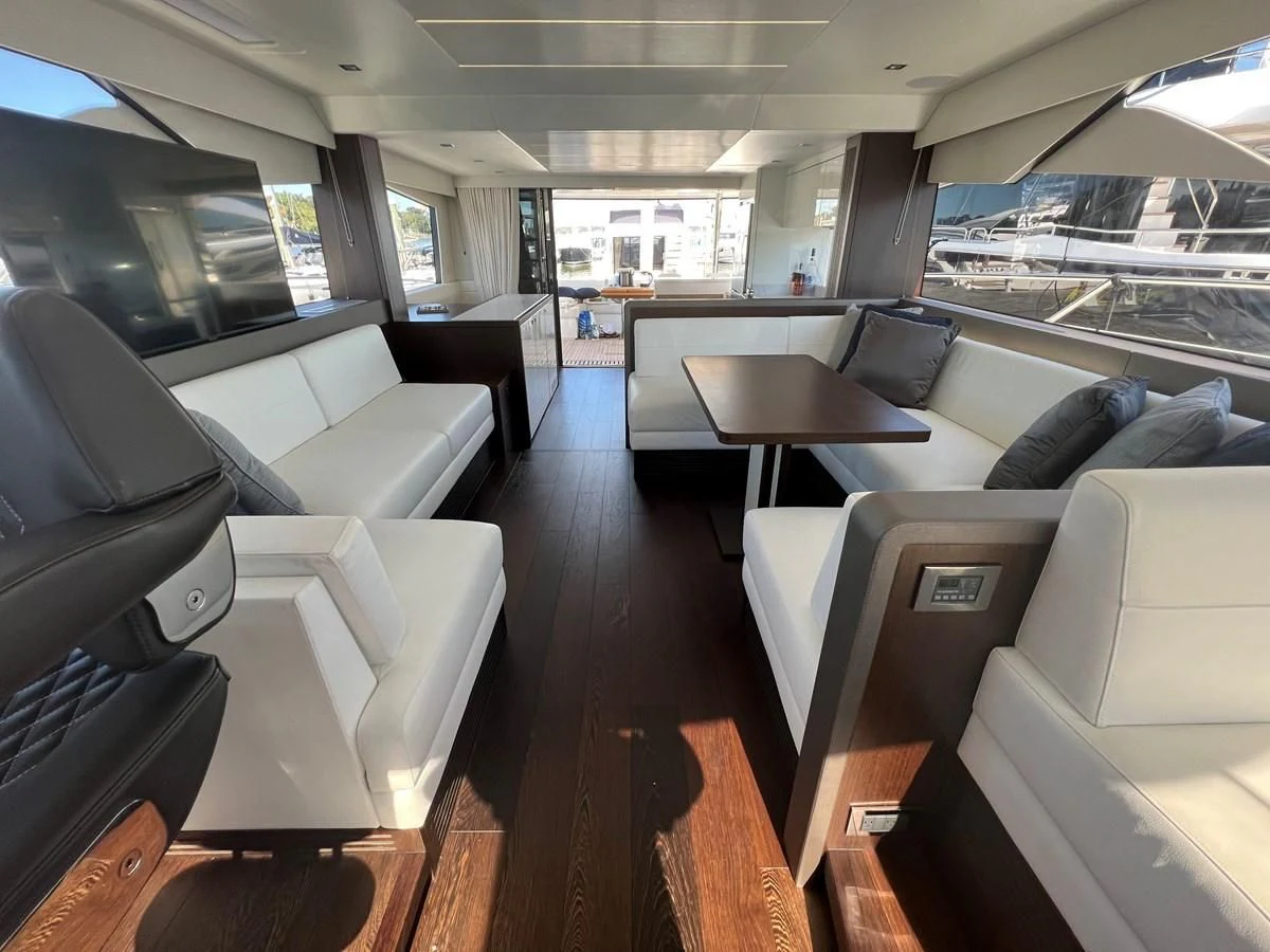 a room with a couch and a table aboard 66 MANHATTAN Yacht for Sale