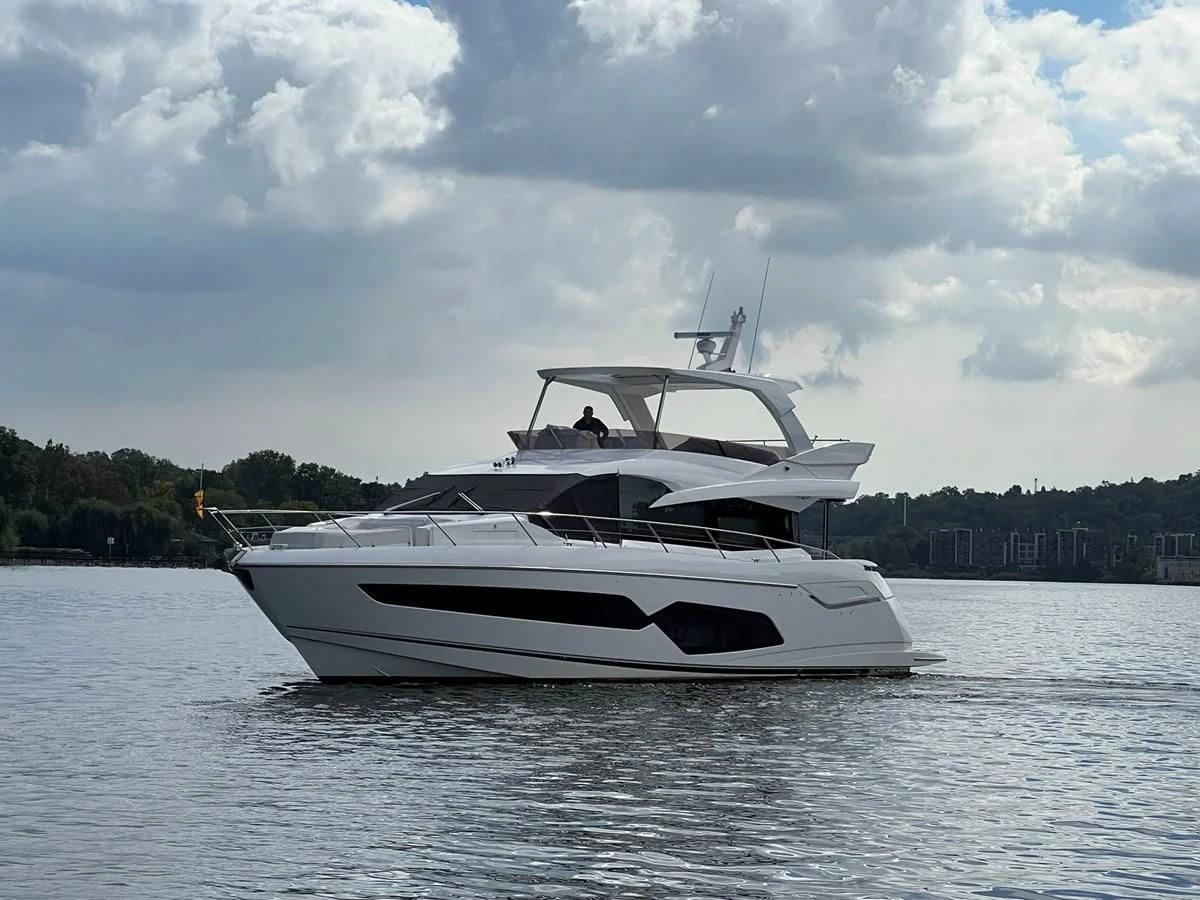 a white yacht on the water aboard 66 MANHATTAN Yacht for Sale