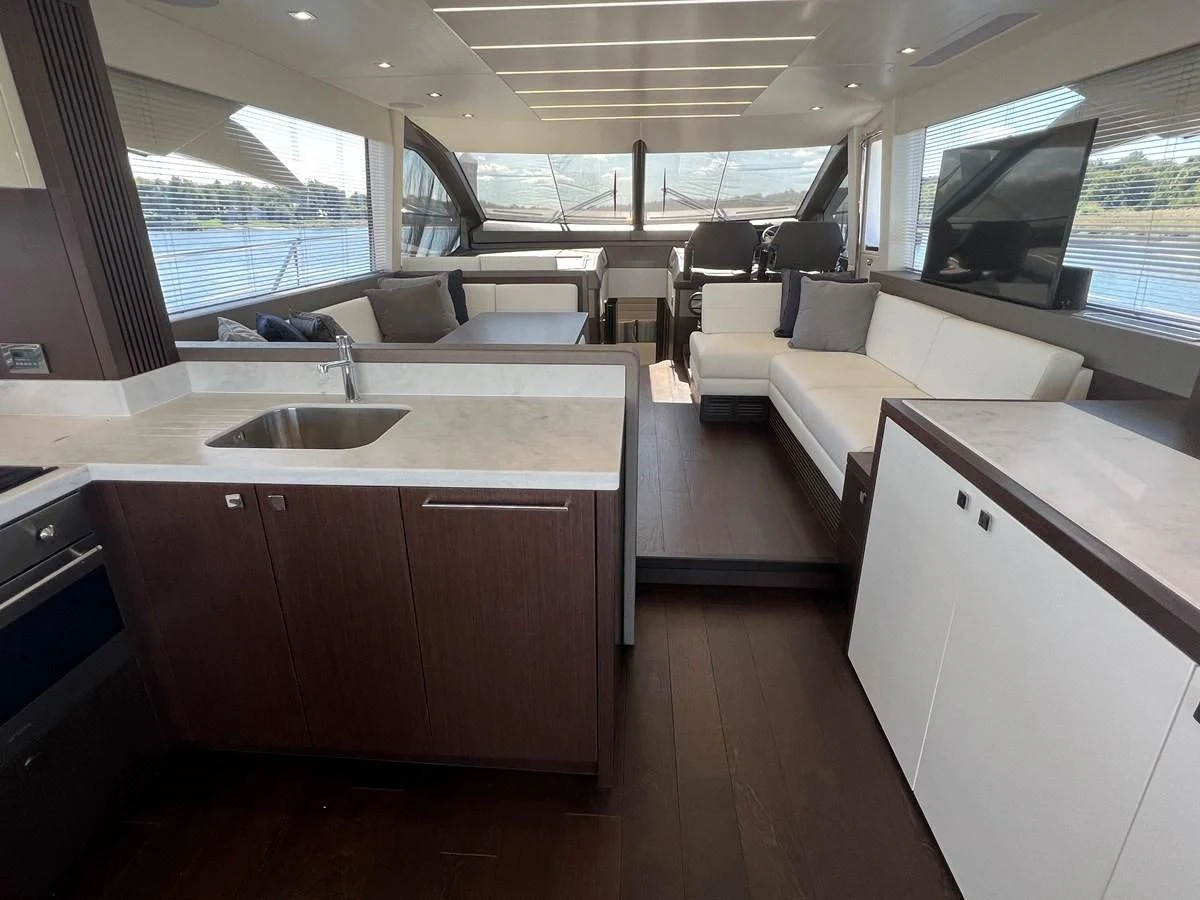 a kitchen with a sink and a couch aboard 66 MANHATTAN Yacht for Sale