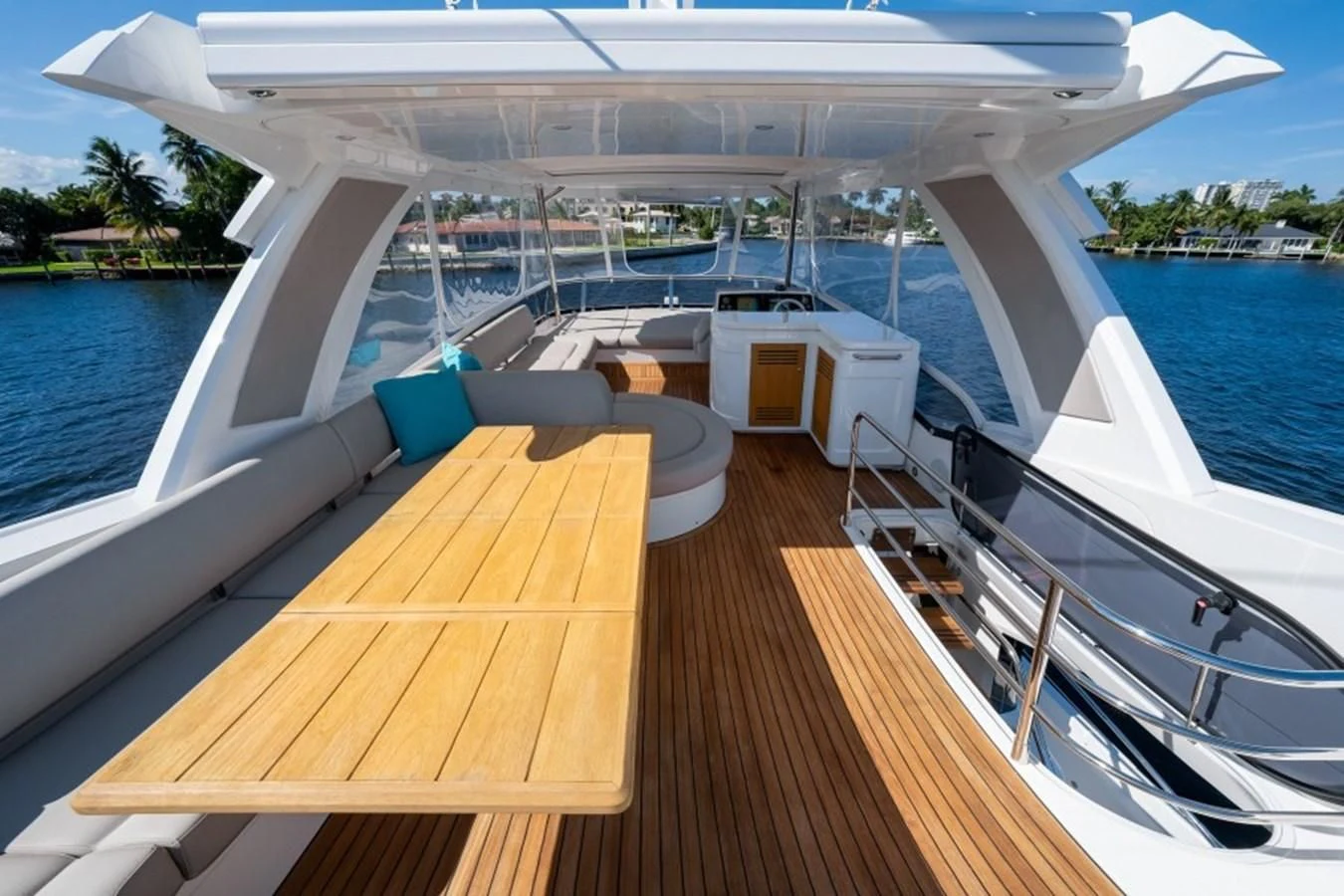 a deck with a pool and a deck with a deck and trees aboard 66 MANHATTAN Yacht for Sale