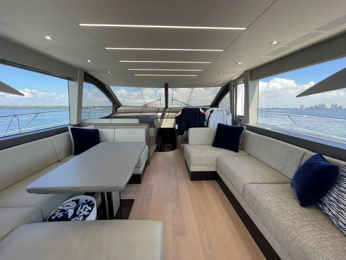 a large room with a couch and a table aboard 66 MANHATTAN Yacht for Sale