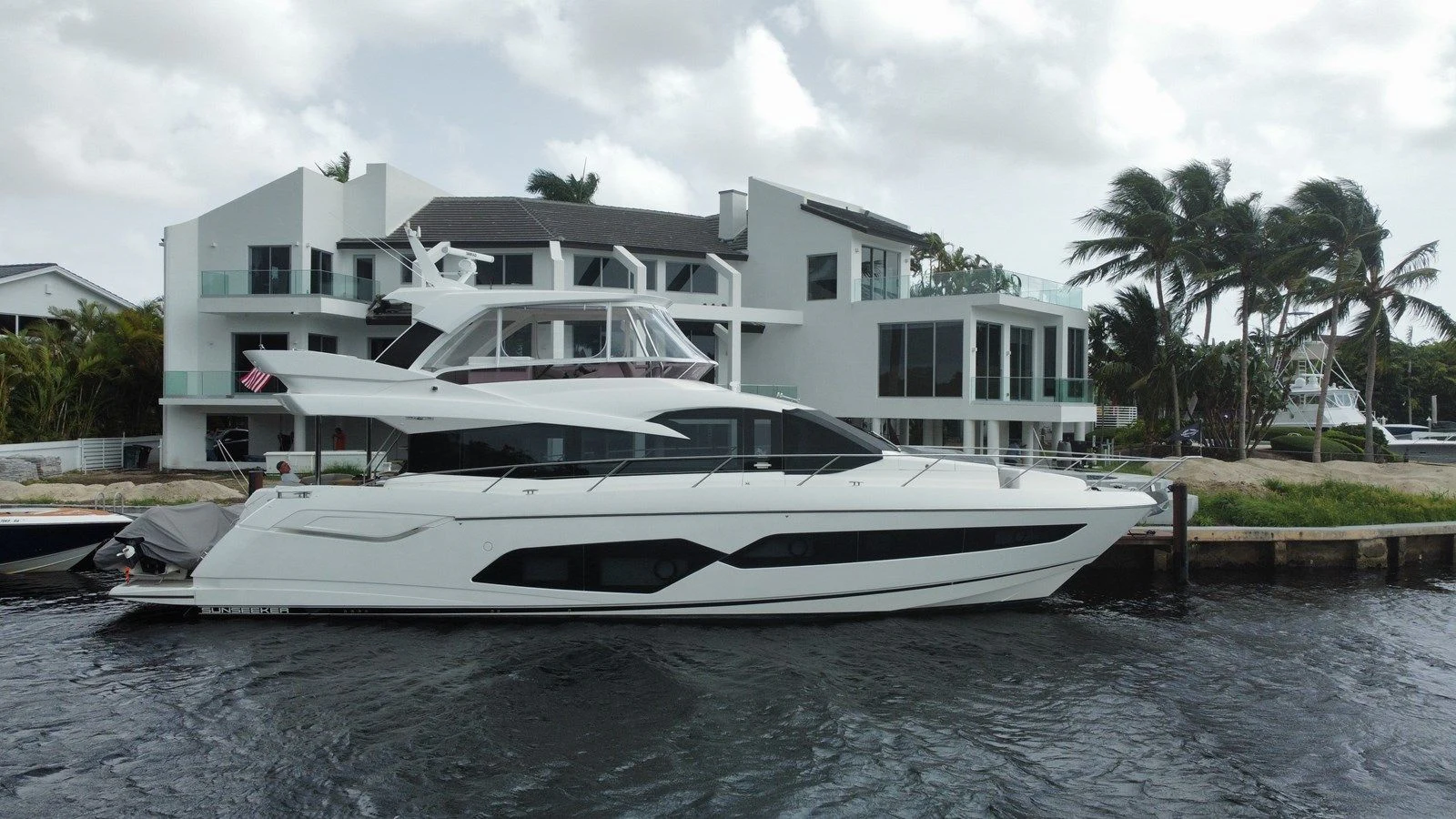 a white boat on the water aboard 66 MANHATTAN Yacht for Sale