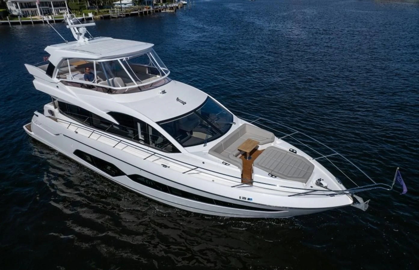 a white yacht on the water aboard 66 MANHATTAN Yacht for Sale