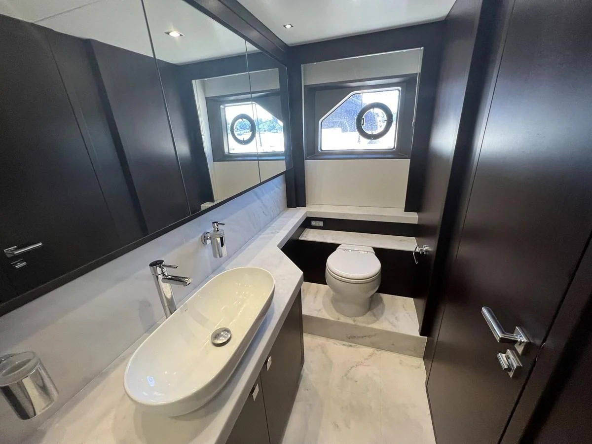 a bathroom with a sink and a toilet aboard 66 MANHATTAN Yacht for Sale