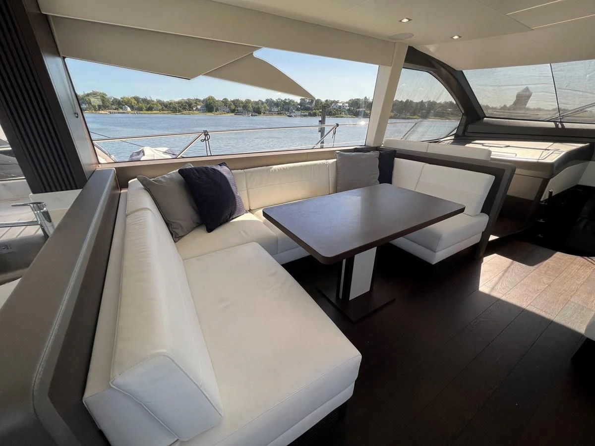 a room with a table and chairs aboard 66 MANHATTAN Yacht for Sale