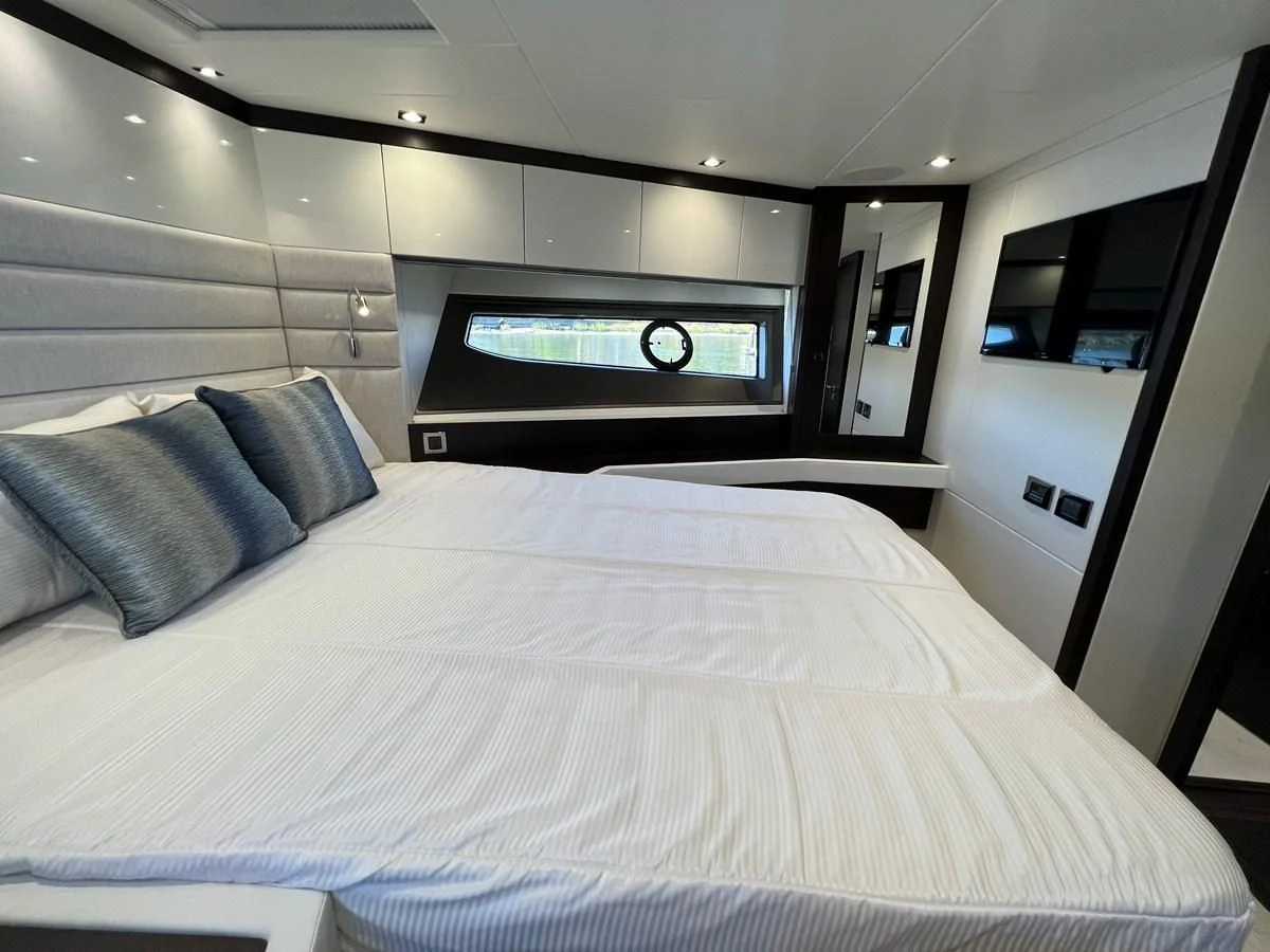 a bed in a room aboard 66 MANHATTAN Yacht for Sale