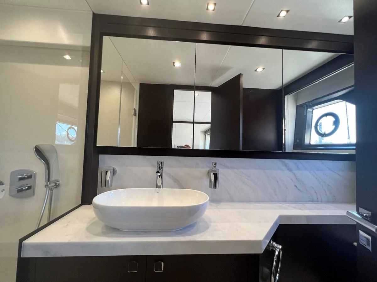 a bathroom with a large mirror aboard 66 MANHATTAN Yacht for Sale