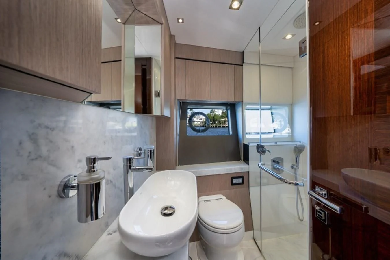 a bathroom with a toilet and sink aboard 66 MANHATTAN Yacht for Sale