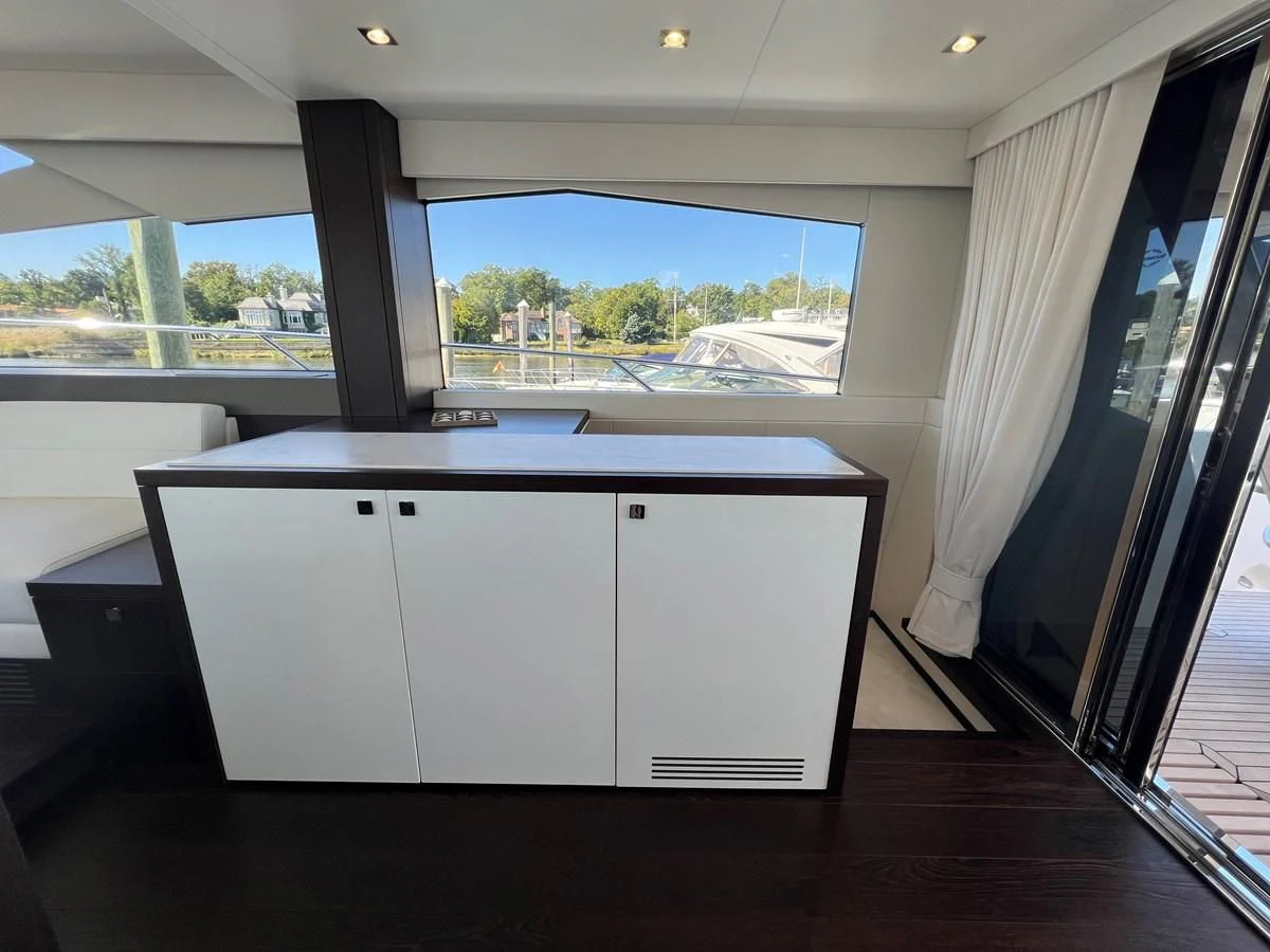 a room with a large window and a view of the water aboard 66 MANHATTAN Yacht for Sale