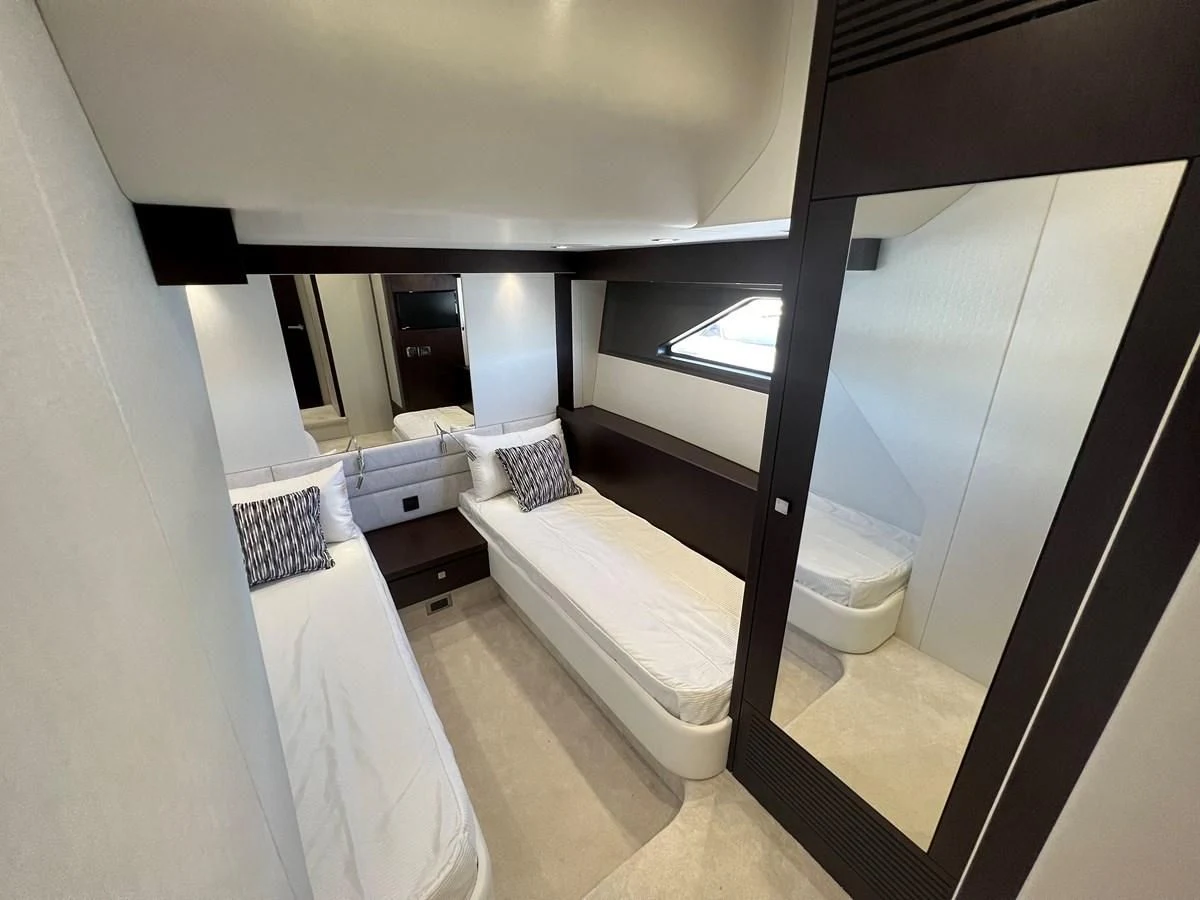 a room with a bed and a window aboard 66 MANHATTAN Yacht for Sale