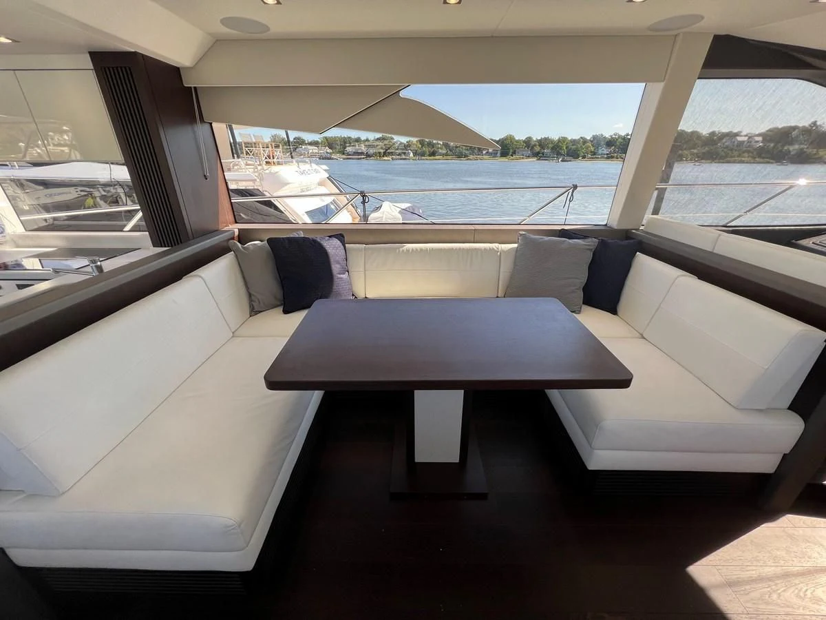 a room with a couch and a table aboard 66 MANHATTAN Yacht for Sale