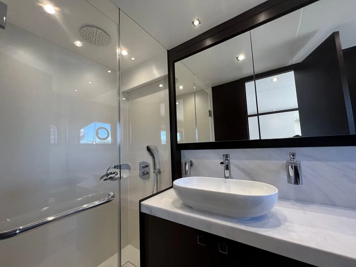 a bathroom with a large mirror aboard 66 MANHATTAN Yacht for Sale