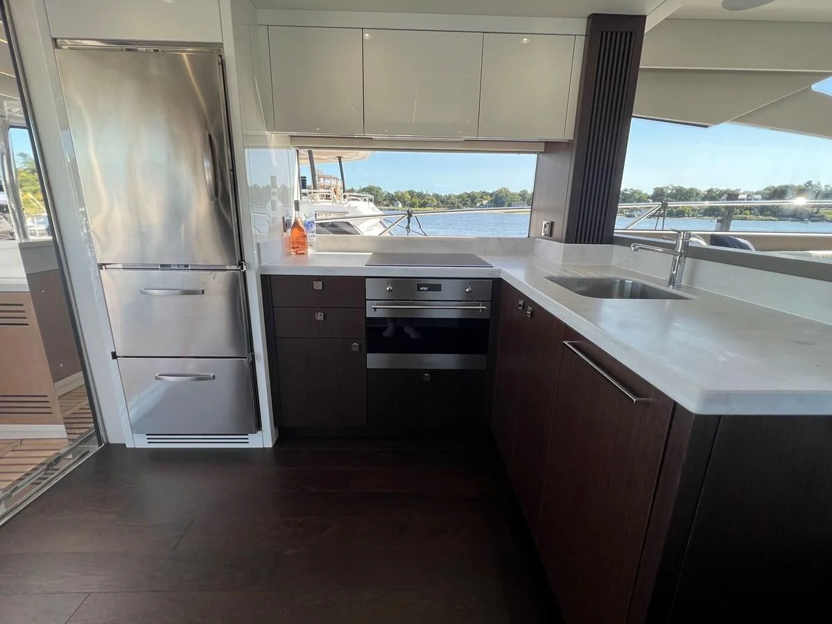 a kitchen with a refrigerator and sink aboard 66 MANHATTAN Yacht for Sale