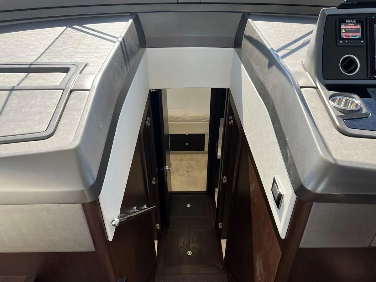 a hallway with a few doors aboard 66 MANHATTAN Yacht for Sale