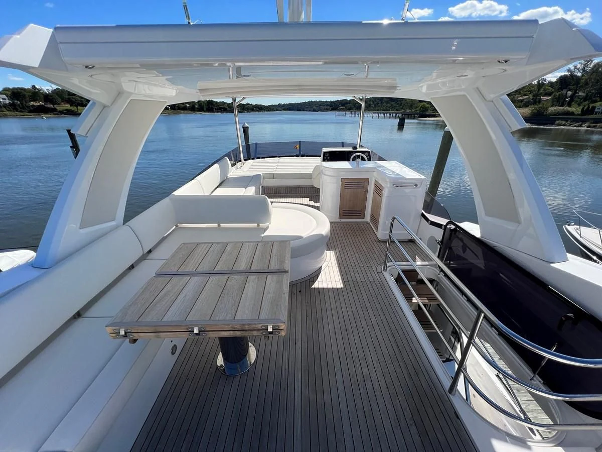 a deck with a view of a body of water and a dock aboard 66 MANHATTAN Yacht for Sale