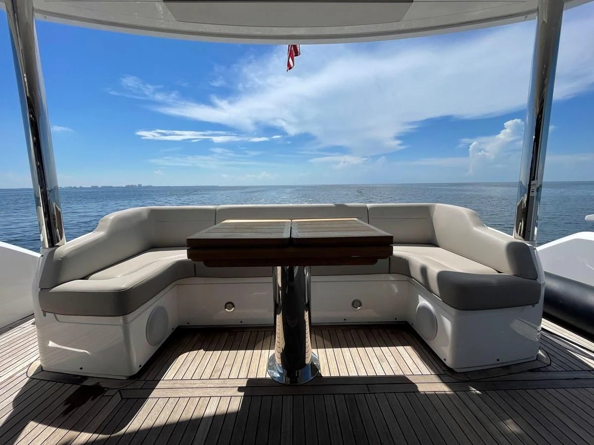 a white couch with a table on it aboard 66 MANHATTAN Yacht for Sale