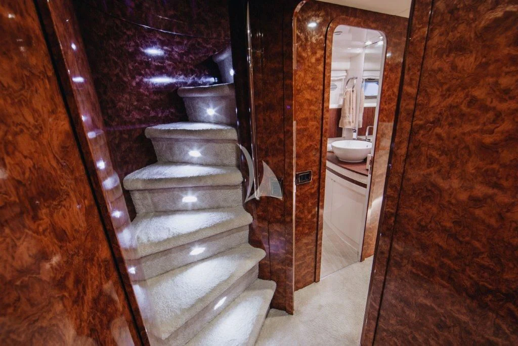 a bathroom with a wood door aboard LADY LONA Yacht for Sale