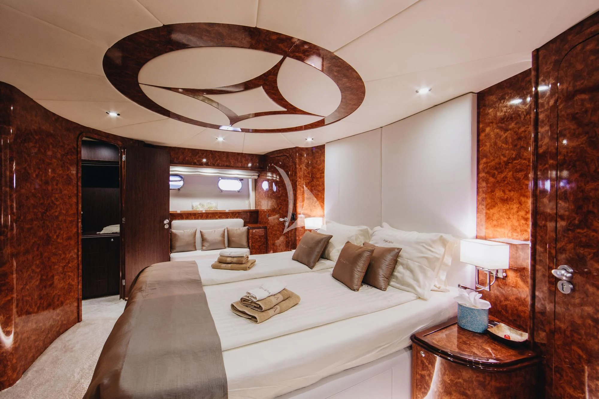 a bed with a white bed spread aboard LADY LONA Yacht for Sale