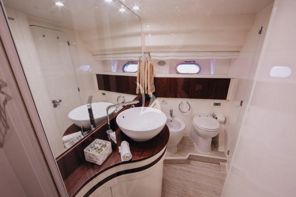 a bathroom with a sink and a toilet aboard LADY LONA Yacht for Sale