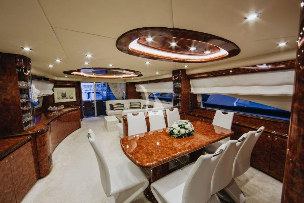 a room with a table and chairs aboard LADY LONA Yacht for Sale