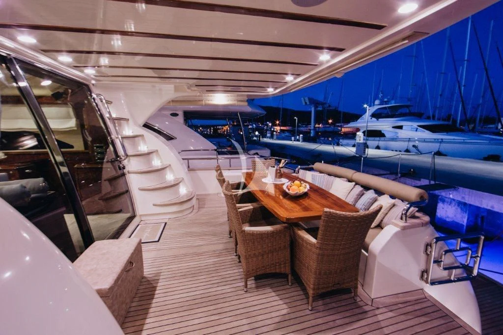a boat with a table and chairs aboard LADY LONA Yacht for Sale