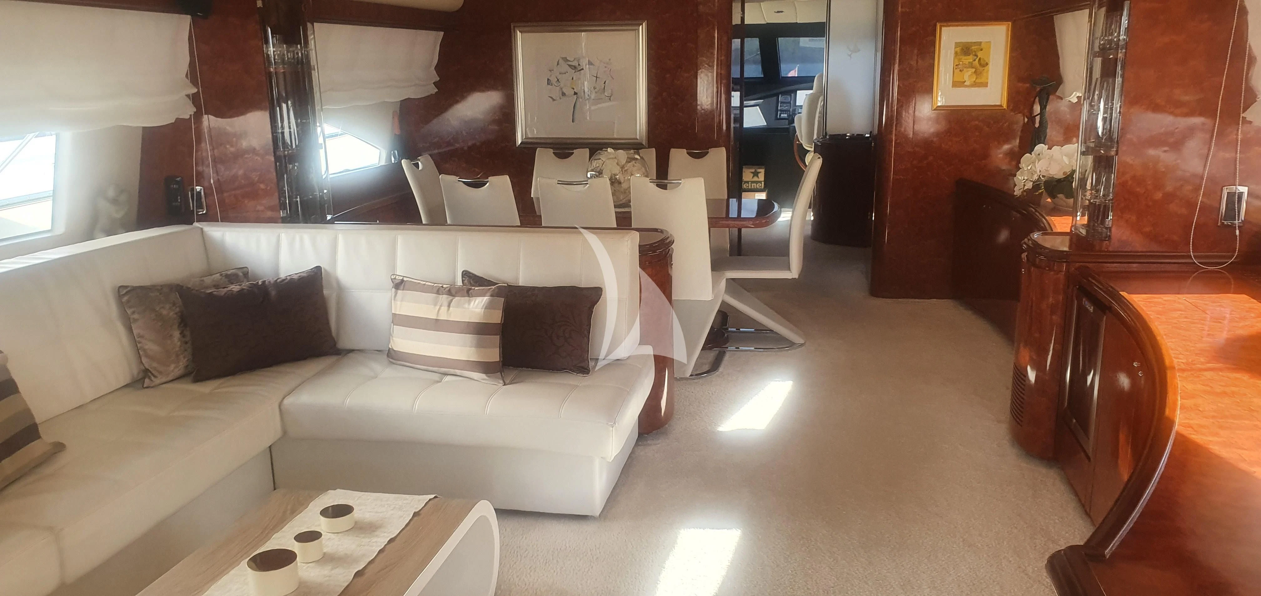 a living room with a white couch aboard LADY LONA Yacht for Sale