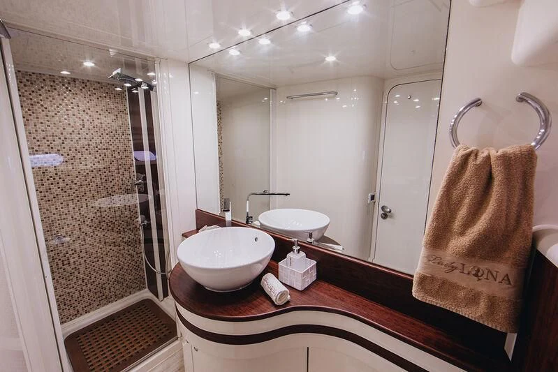 a bathroom with a sink and a mirror aboard LADY LONA Yacht for Sale