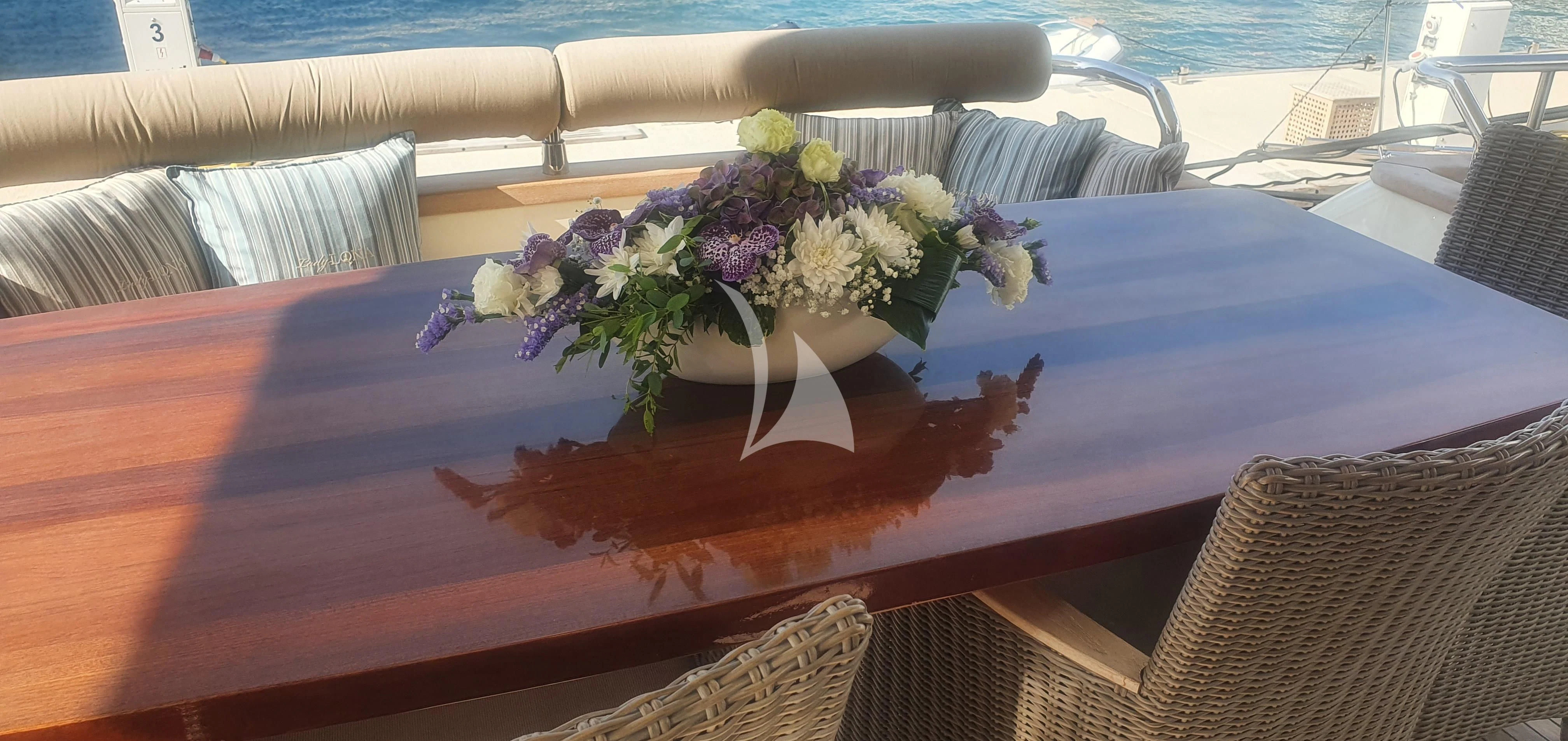 a bouquet of flowers on a table aboard LADY LONA Yacht for Sale