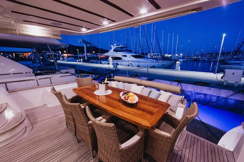 a table and chairs on a deck aboard LADY LONA Yacht for Sale
