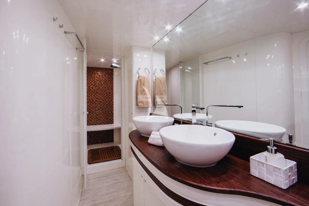 a bathroom with a sink and tub aboard LADY LONA Yacht for Sale