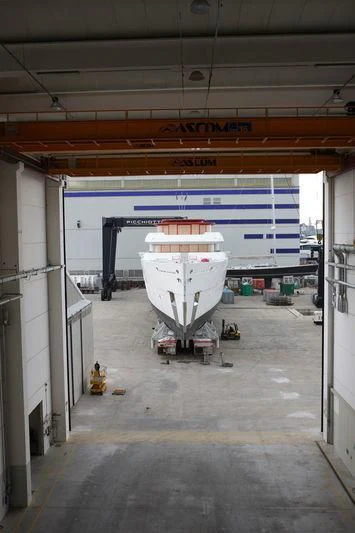 a large white machine in a warehouse aboard NAUTILUS Yacht for Sale