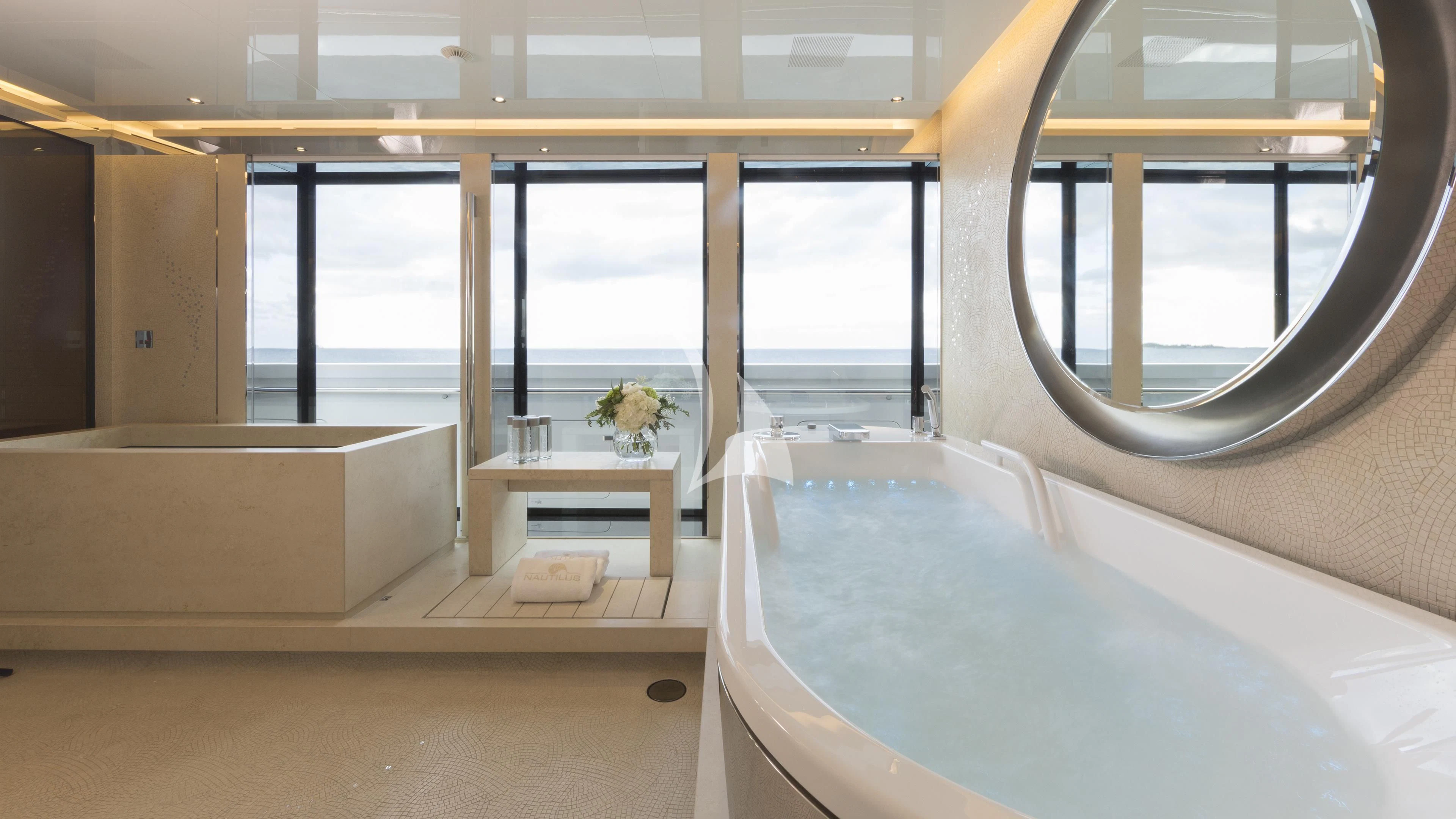 a room with a large window and a view of the ocean aboard NAUTILUS Yacht for Sale