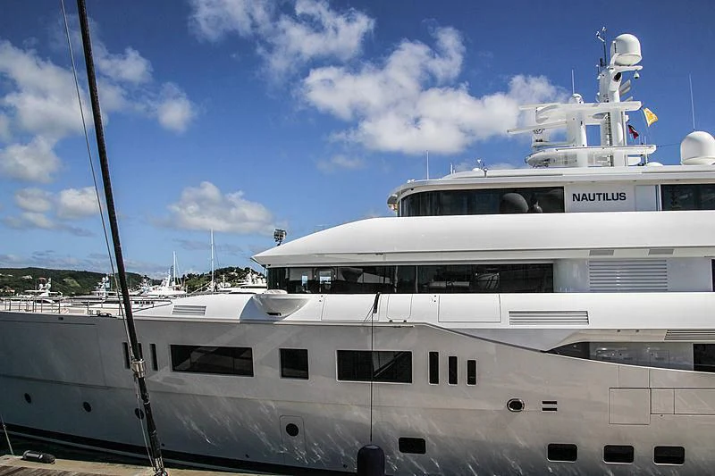 a white yacht under a blue sky aboard NAUTILUS Yacht for Sale