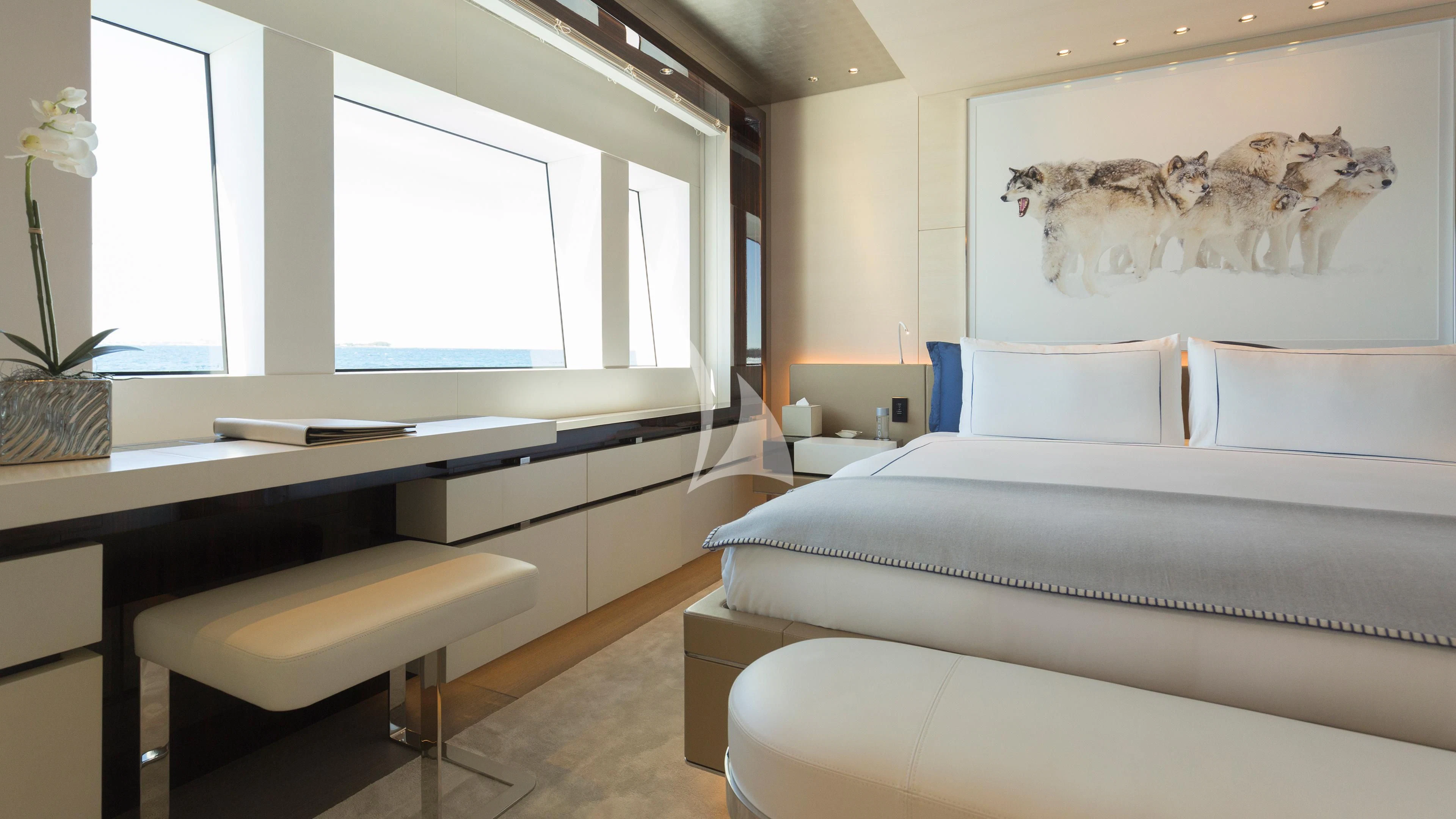 a room with a bed and desk aboard NAUTILUS Yacht for Sale