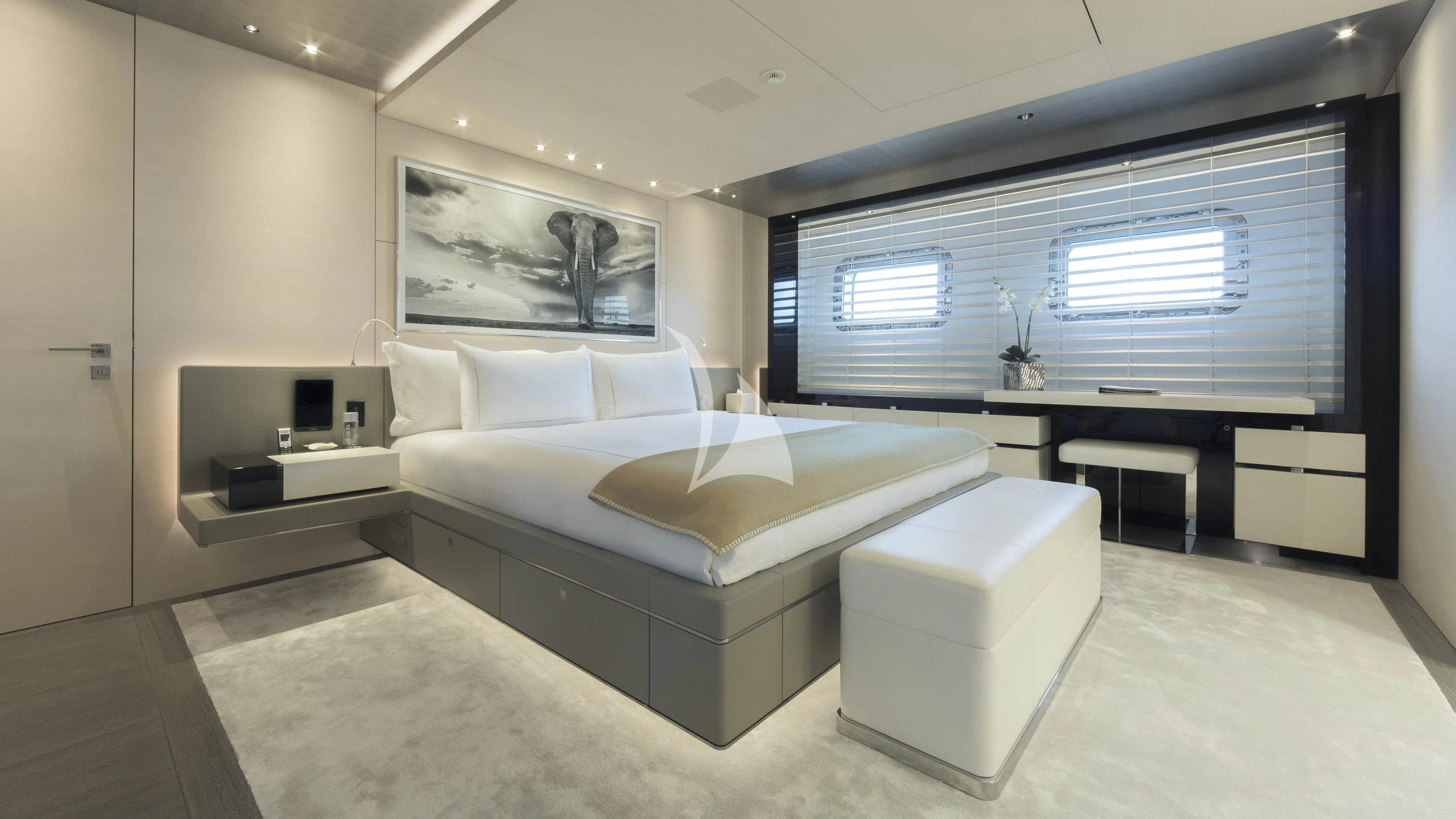 a large room with a bed and a desk aboard NAUTILUS Yacht for Sale