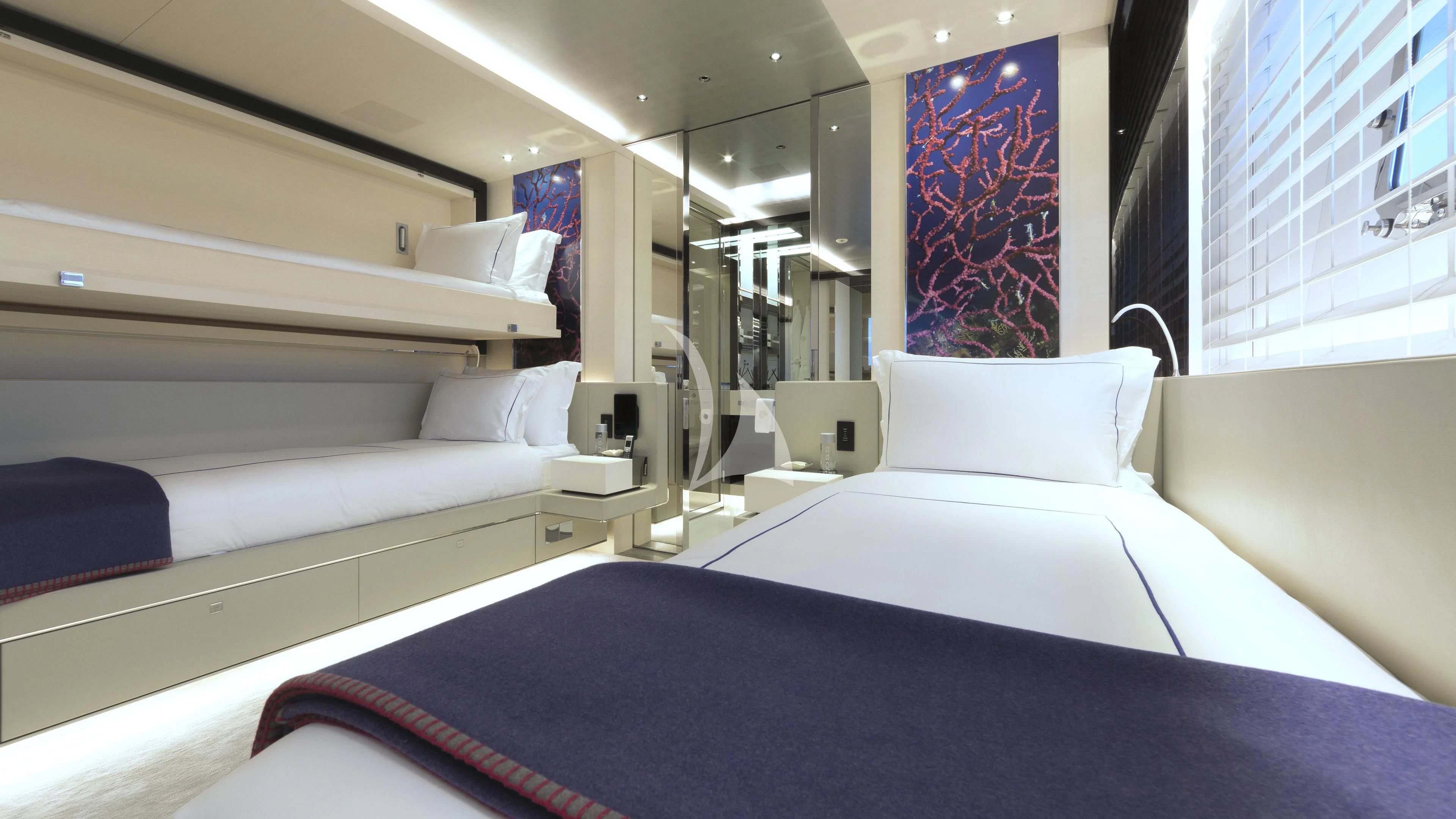 a room with beds and a window aboard NAUTILUS Yacht for Sale