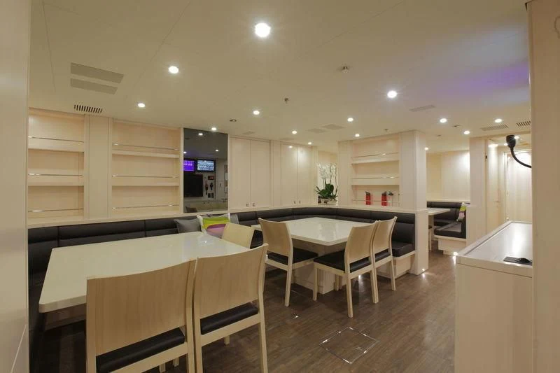 a kitchen with a table and chairs aboard NAUTILUS Yacht for Sale