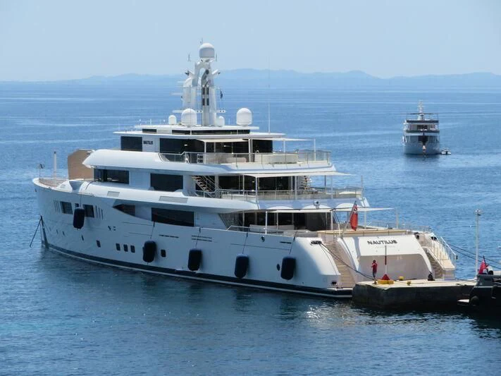 a large white boat with a smaller boat in it aboard NAUTILUS Yacht for Sale