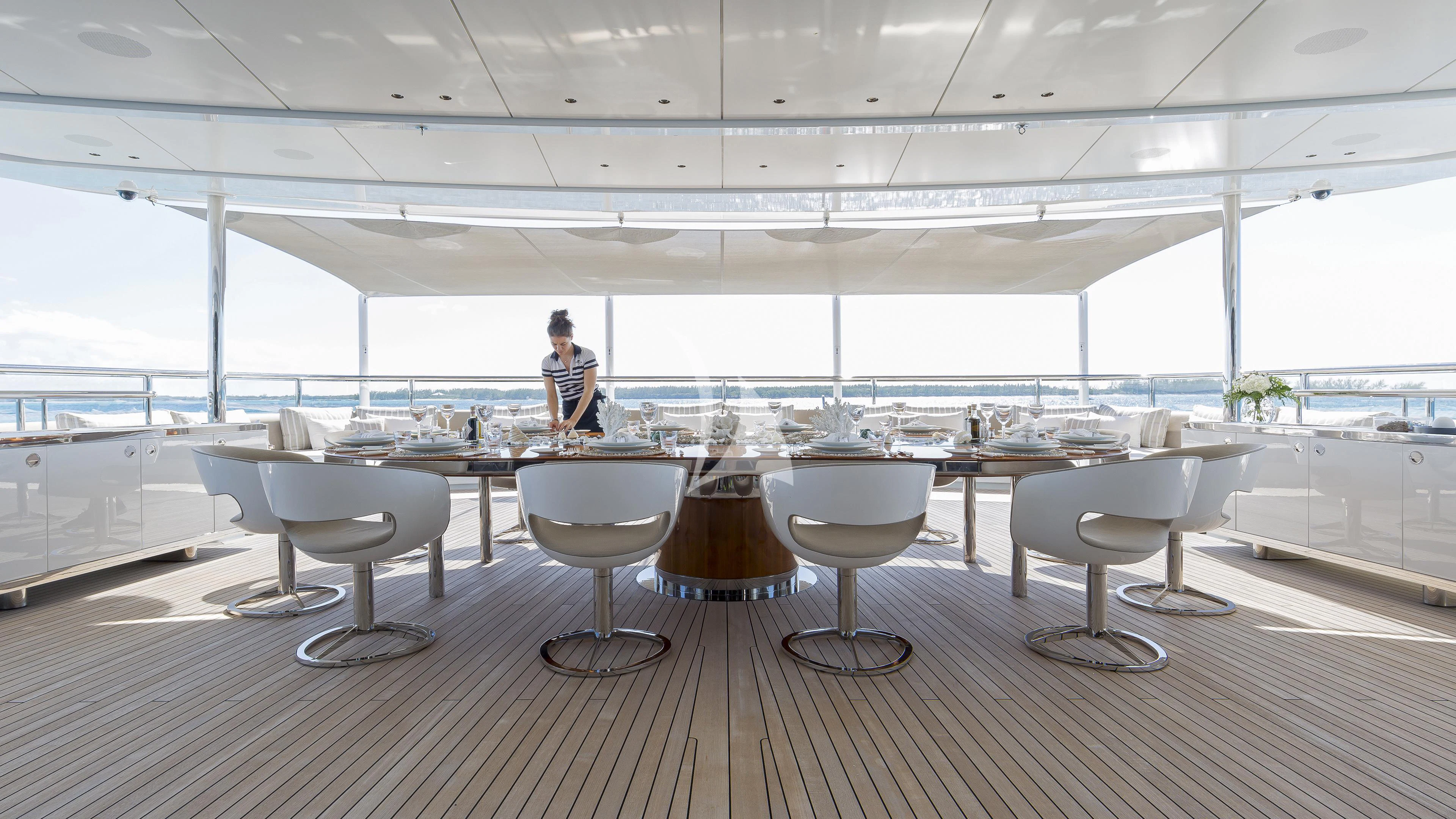 a person sitting at a table aboard NAUTILUS Yacht for Sale