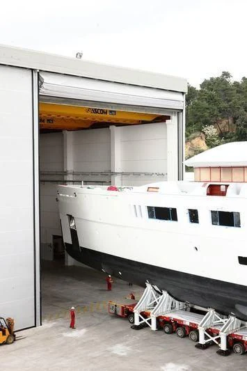 a boat being loaded with cargo aboard NAUTILUS Yacht for Sale